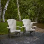 C01 Classic Adirondack Chair in Beige-Chocolate Two Tone HDPE recycled plastic on a slate patio with birch trees in back