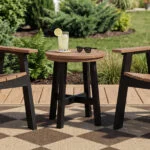 Two C41 Chat Chairs in Black-Dune Two Tone, with a T02 Round Side Table on a deck