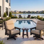 DSF294 Charleston Swivel Armchairs in front of a pool.