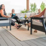 DSF281 Tofino Deep Seating Armchair in Black on a patio with women socializing