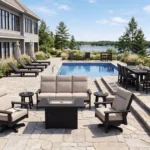 DSF293 Charleston Sofa with DSF294 Charleston Swivel Arm Chairs in 28-Granite, with FT01 Fire Table. Poolside on right is a Napa Dining Set with 8 Napa Arm Chairs, on the right, 4 L99 Armless Lounge Chairs.