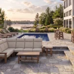 Charleston Sectional Poolside in Dune with Napa Dining Set and L99 Armless Lounge Chairs poolside at a lakeside house