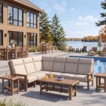 Charleston Sectional in Dune with Nuance Eggshell Cushions, poolside beside a large lake house. Napa Dining Set and L99 Armless Lounge Chairs in the back.