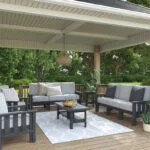 Stratford Collection Deep Seating Sofas and Arm Chairs on a covered patio